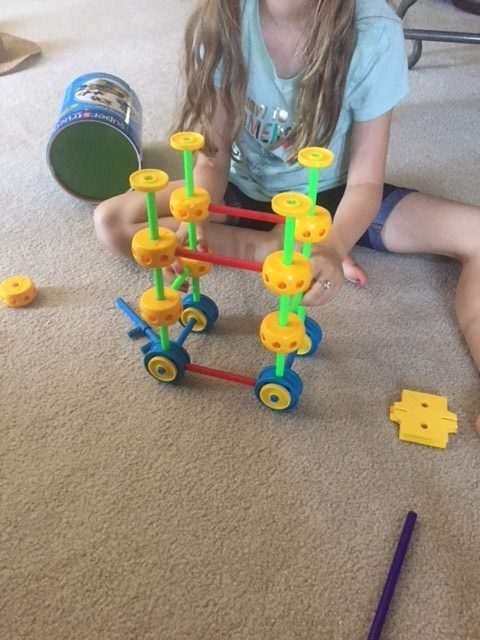Girl Playing with Superstructs